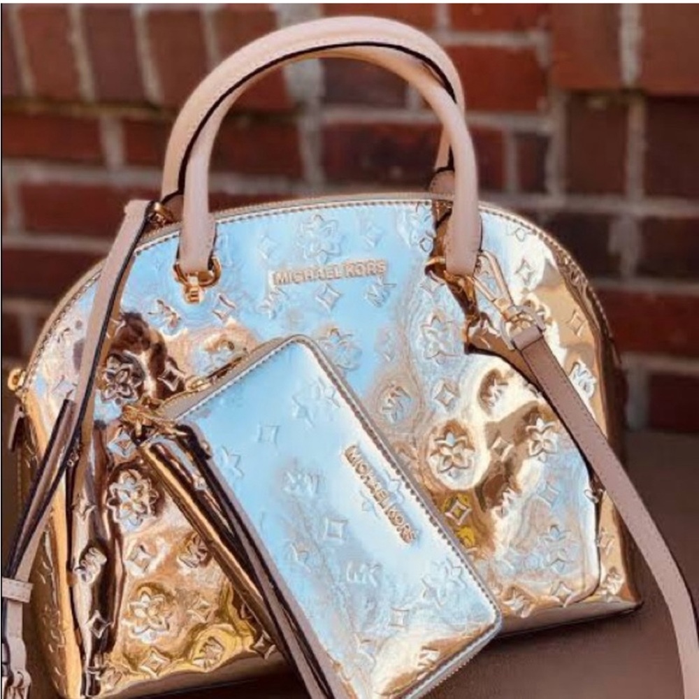 Michael Kors Rose Gold hand bag and matching wallet.